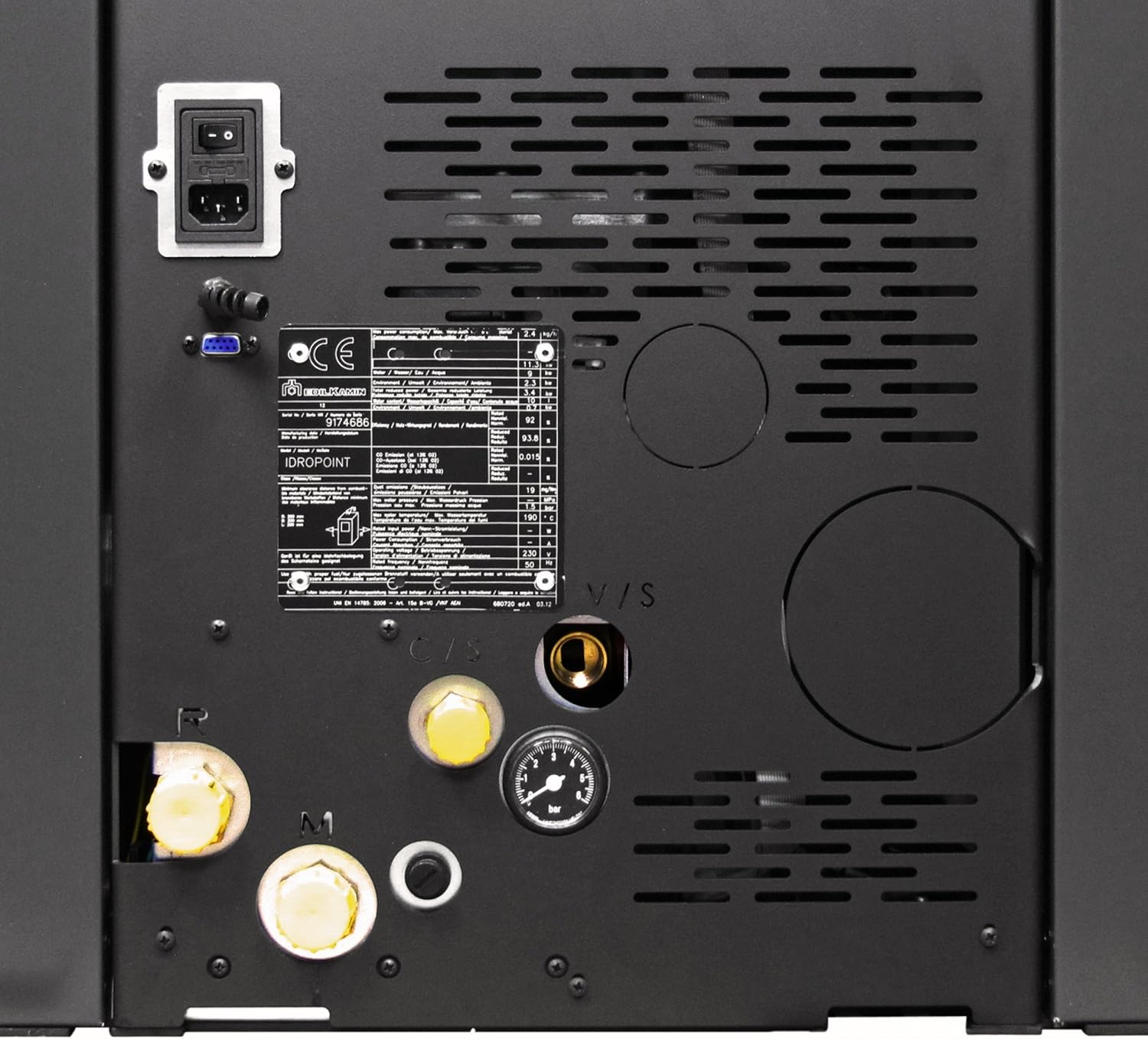 Atzekoa view of the pellet oven, showing various connection points for water pipes, electrical power, and the chimney flue.