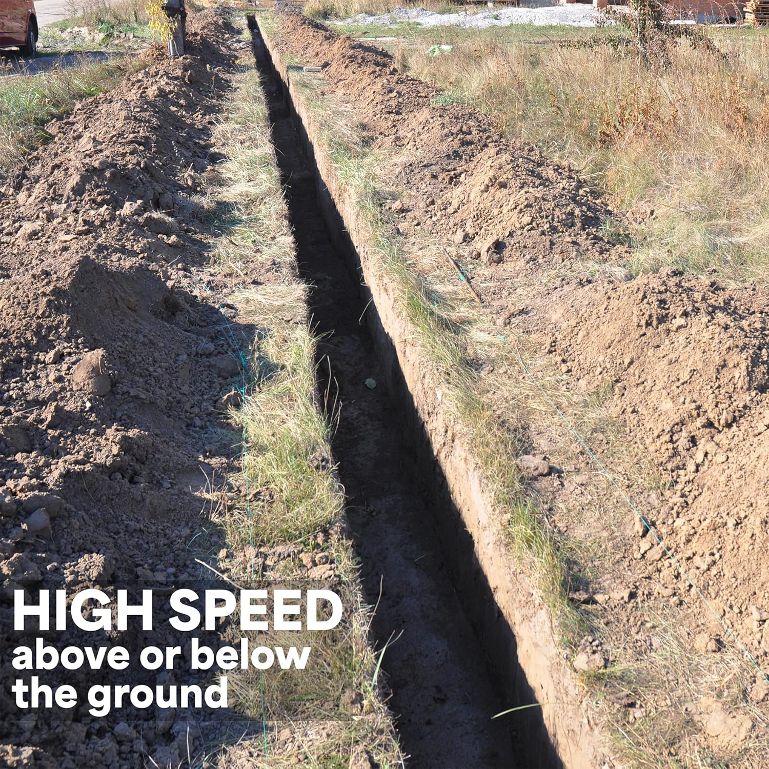 A long, narrow trench dug in the ground for direct burial of an outdoor cable