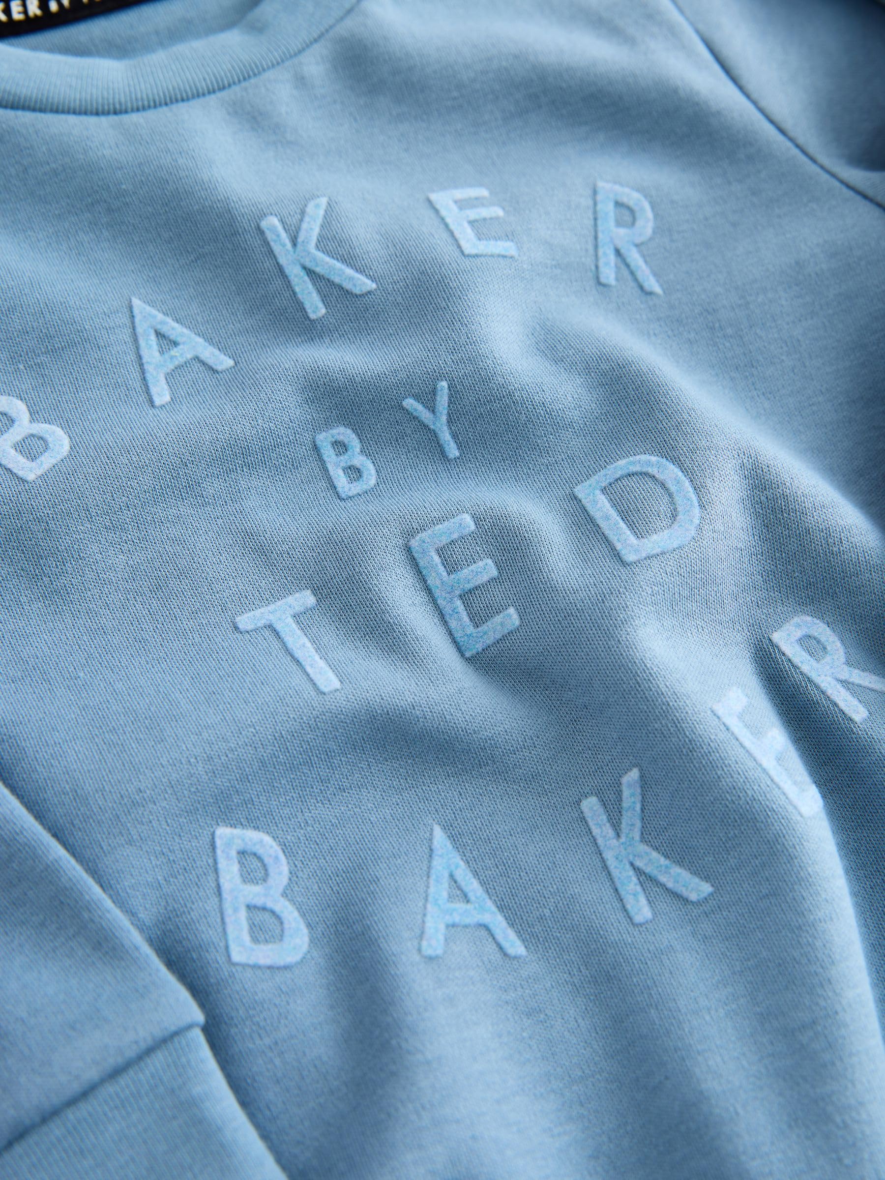 Noworodki chłopcy Niebieski komplet Baker by Ted Baker: śpioszki i dwustronna czapka