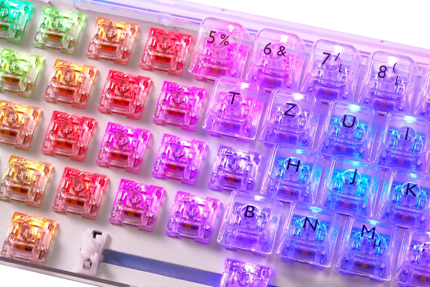 Nahaufnahme view of the keyboard with several keycaps and switches removed, revealing the hot-swappable sockets and RGB LEDs.