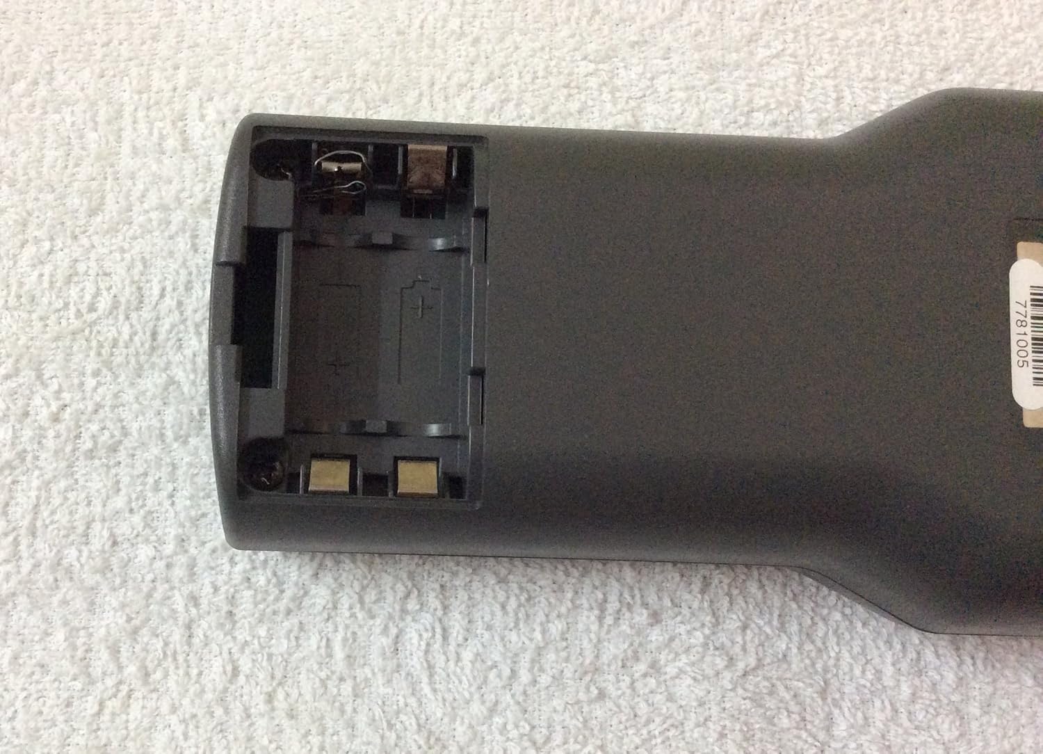 Rear view of the Fluke 620 CableMeter with the battery compartment open, showing empty battery slots.