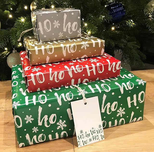 Christmas Wrapping Paper. 8 XL Sheets (50 x 70cm). HoHoHo design in 4 colours including metallic silver and gold. Gift Wrap pack with matching Tags. Cutting grid on reverse.