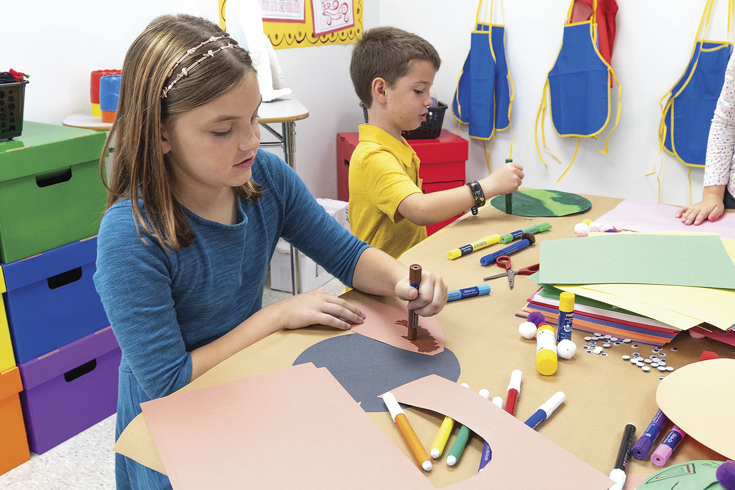 Close-up of Prang construction paper sheets showing the texture and color assortment.