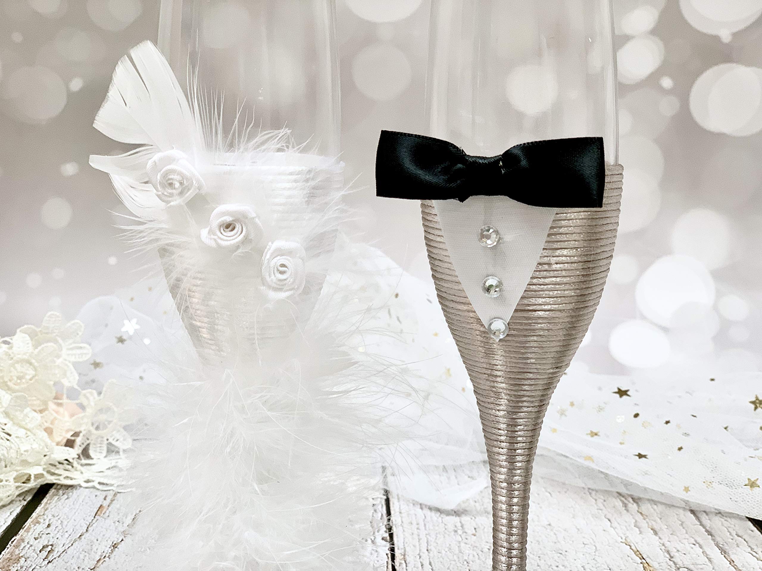 wedding dress champagne flute A bride in a white dress and veil, holding a champagne bottle, sits with three women