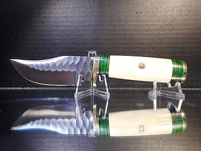 Bone fixed blade knife with green accents. 1095 steel and leather sheath