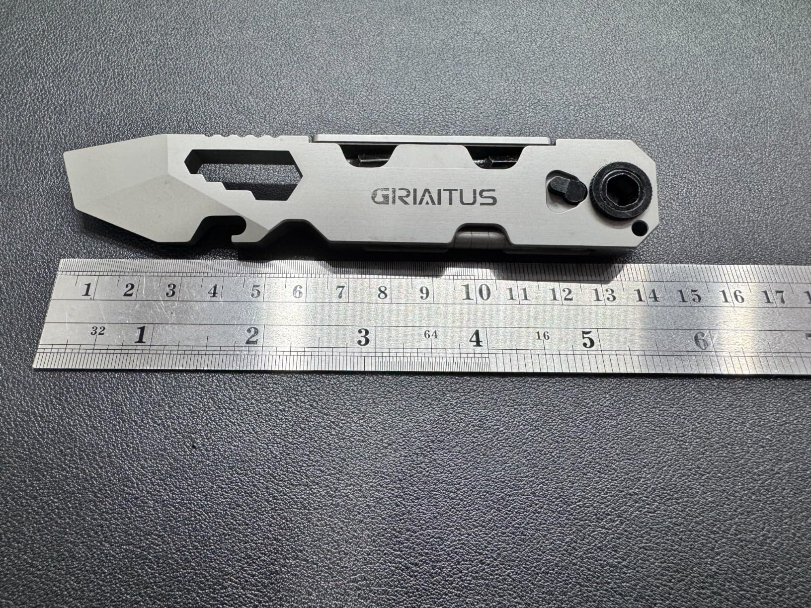 EDC Pry Bar Multitool next to a ruler showing its length