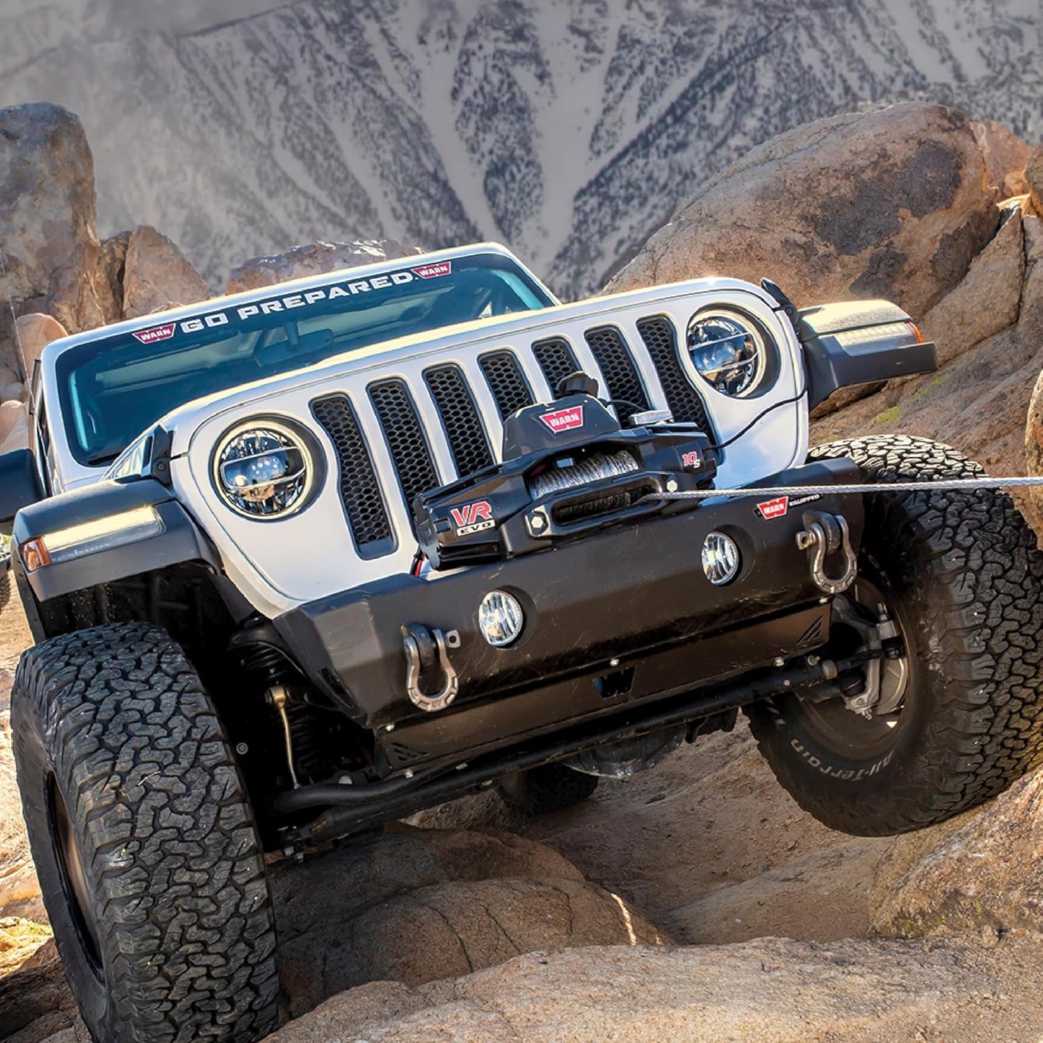 Jeep being recovered by a WARN VR EVO 10 winch in an off-road setting