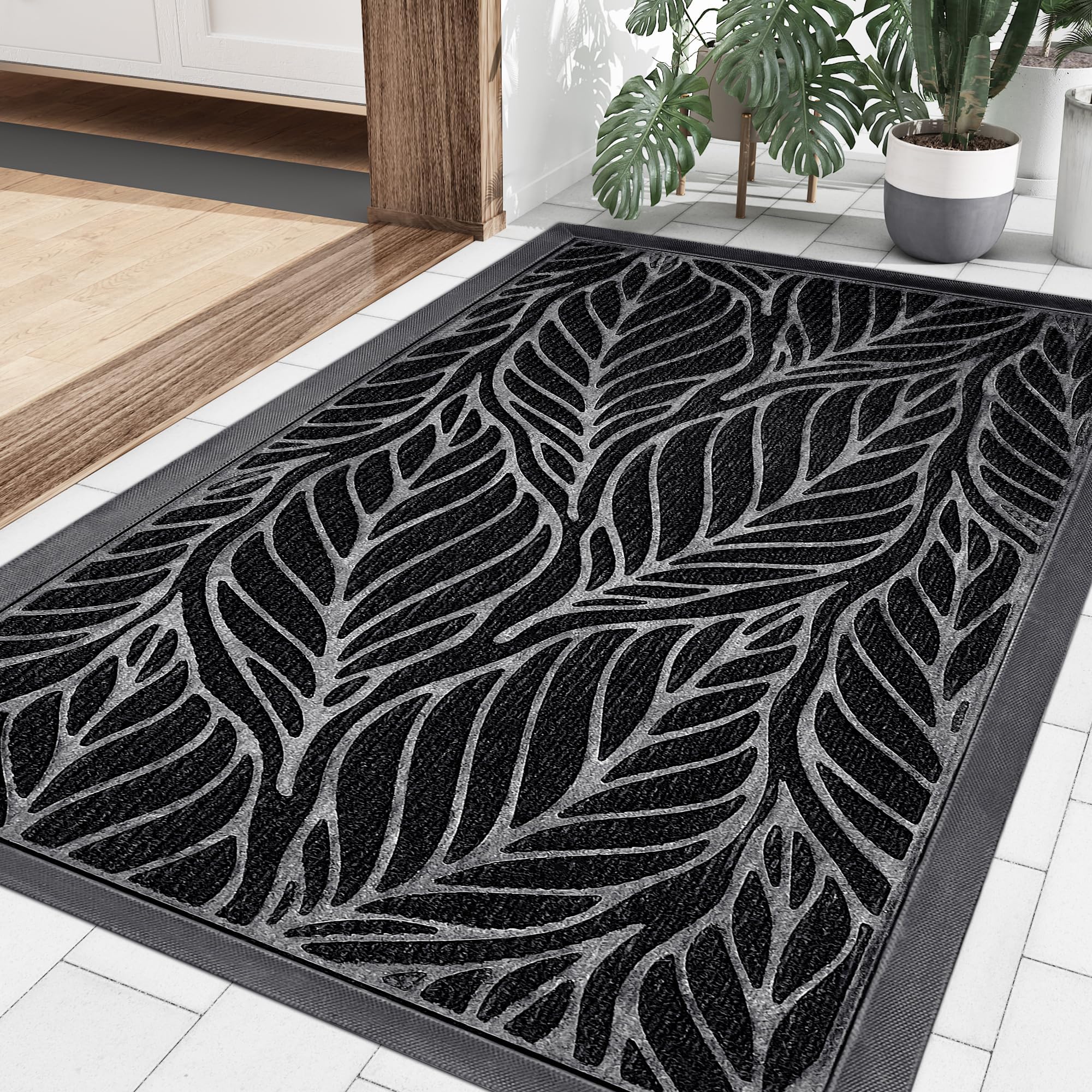 Paillasson robuste et élégant motif feuilles tapis d'entrée chic noir durable