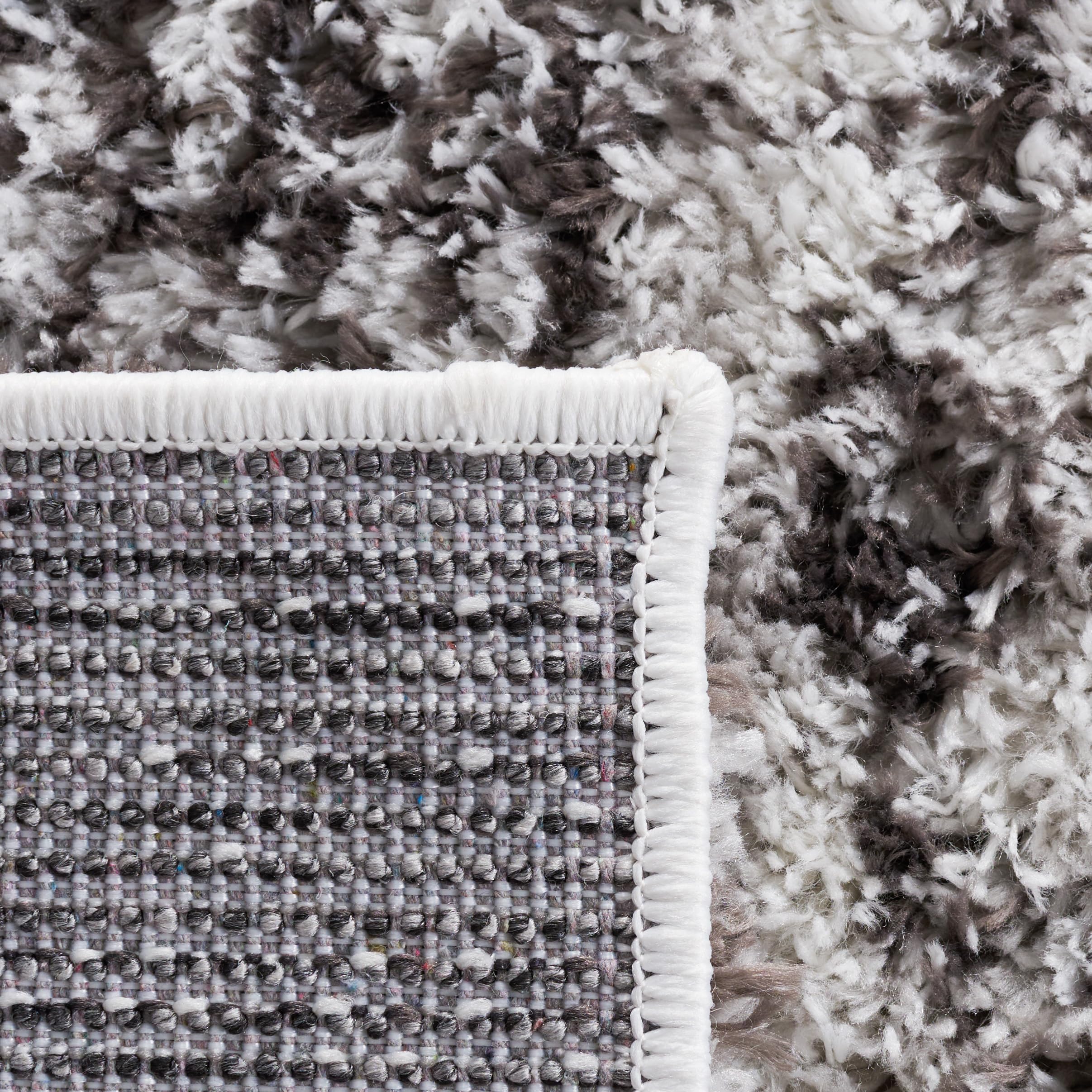 Condition photo showing New/Like New for SAFAVIEH Berber Shag Collection Area Rug - 10' x 14', Grey & Dark Grey, Non-Shedding & Easy Care, 1.2-inch Thick, Ideal for The Living Room, Dining, Bedroom (BER569F)