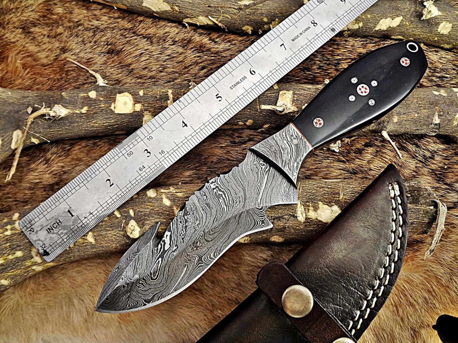 9" Long hand forged Damascus steel full tang skinning Knife with gut hook, Natural Bull horn with Brass Bolster, Cow hide Leather sheath