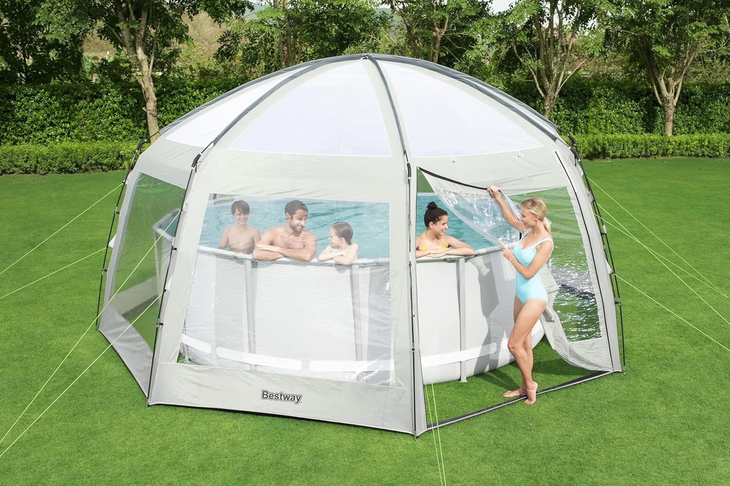 People entering and exiting the Bestway Round Dome Tent with a pool inside