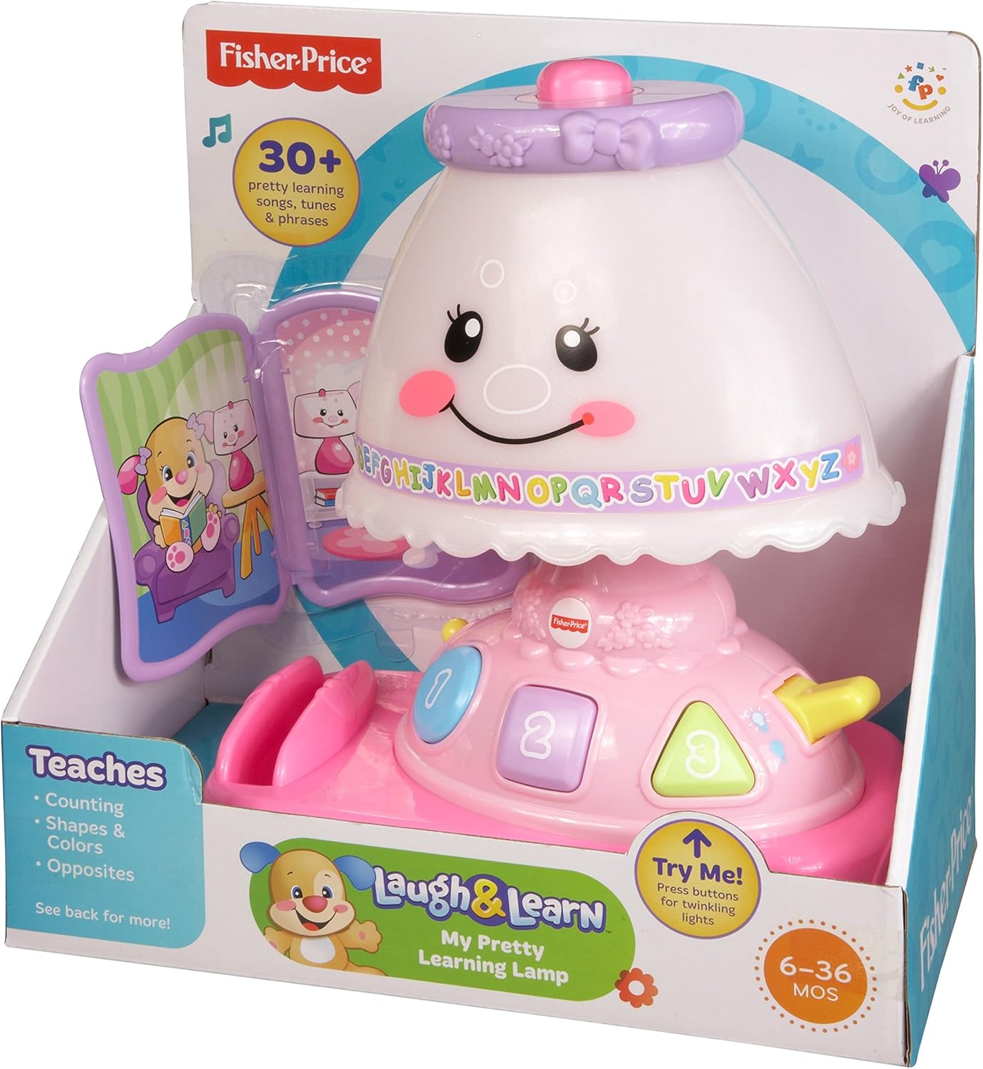 The Fisher-Price Laugh & Learn My Pretty Learning Lamp in its retail packaging, showing the lamp and the plastic book accessory.