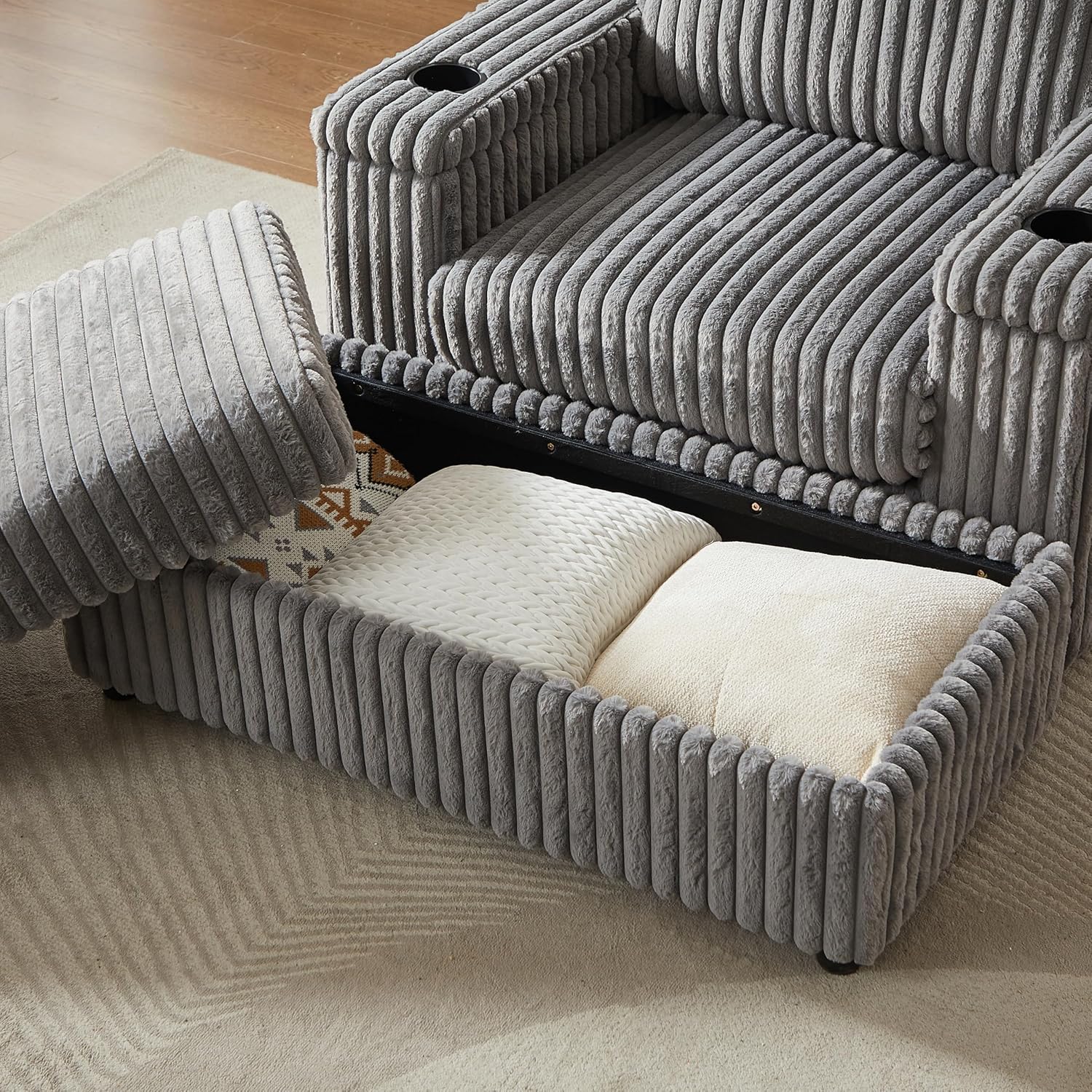 Close-up of chair armrest showing a cupholder and side storage pocket