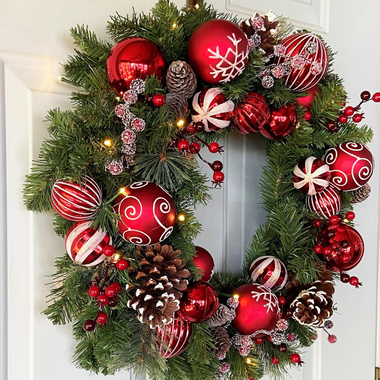 Haute Decor 26 Inch Holiday Times Wreath with Soft White LED Lights and Automatic Timer - Christmas Wreath with Patterned Red and White Shatterproof Ornaments, Berries, and Real Pinecones…