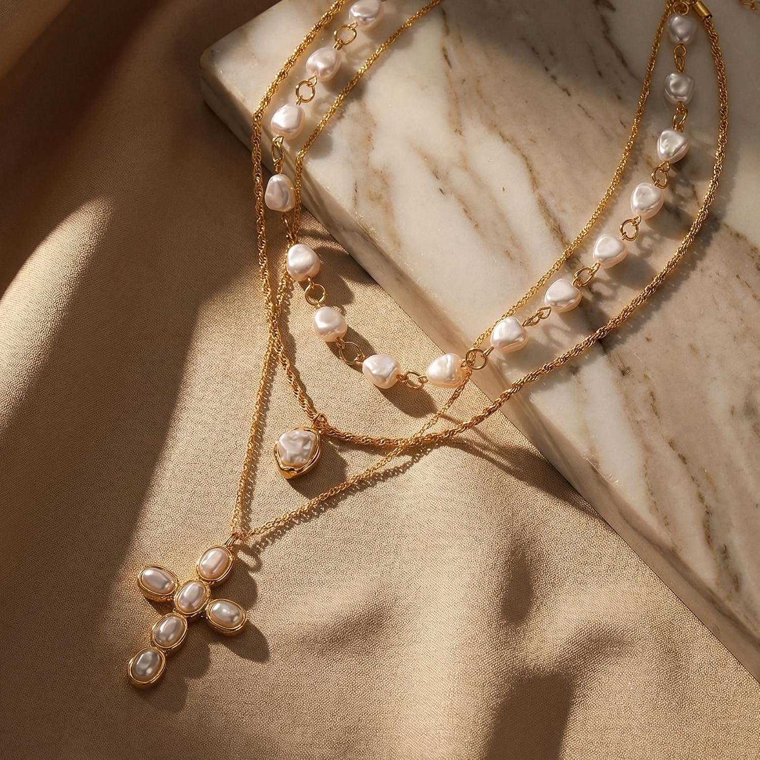 3 Pcs Layered Faux Pearl Cross Necklace Set for Women Choker | Radiant gold-tone chains featuring chunky irregular baroque beads.
