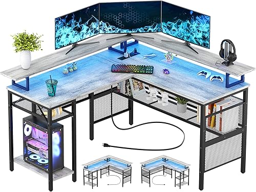 Unikito Escritorio reversible en forma de L, escritorio de esquina de 55 pulgadas con tira de luz inteligente y toma de corriente mágica, mesa de