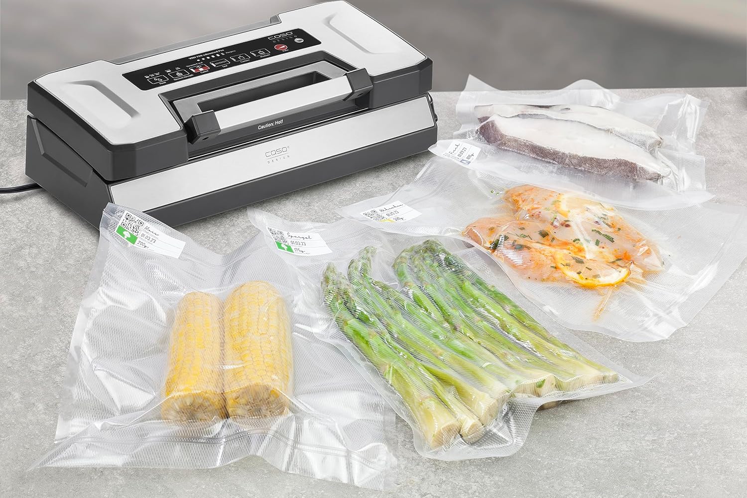 Various vacuum-sealed food items including corn on the cob, asparagus, and fish fillets, demonstrating food preservation