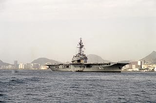 Home Comforts A starboard bow view of the Brazilian aircraft carrier MINAS GERAIS (A-11) anchored in the harbor_1-12 Inch by 18 Inch Laminated Poster - Bright Colors And Vivid Imagery