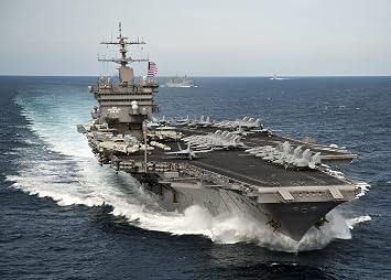 Home Comforts The Aircraft Carrier USS Enterprise CVN 65 is underway with The Enterprise Carrier Strike Group i Vivid Imagery Laminated Poster Print-20 Inch by 30 Inch Laminated Poster