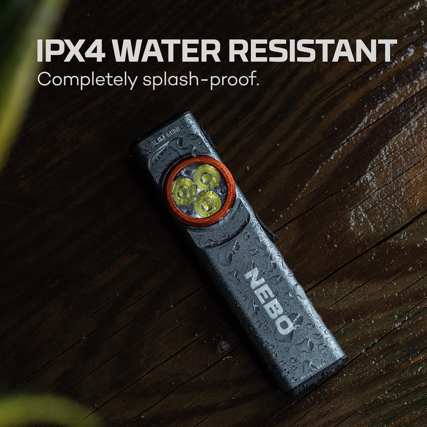 NEBO SLIM Mini with water droplets, demonstrating IPX4 water resistance