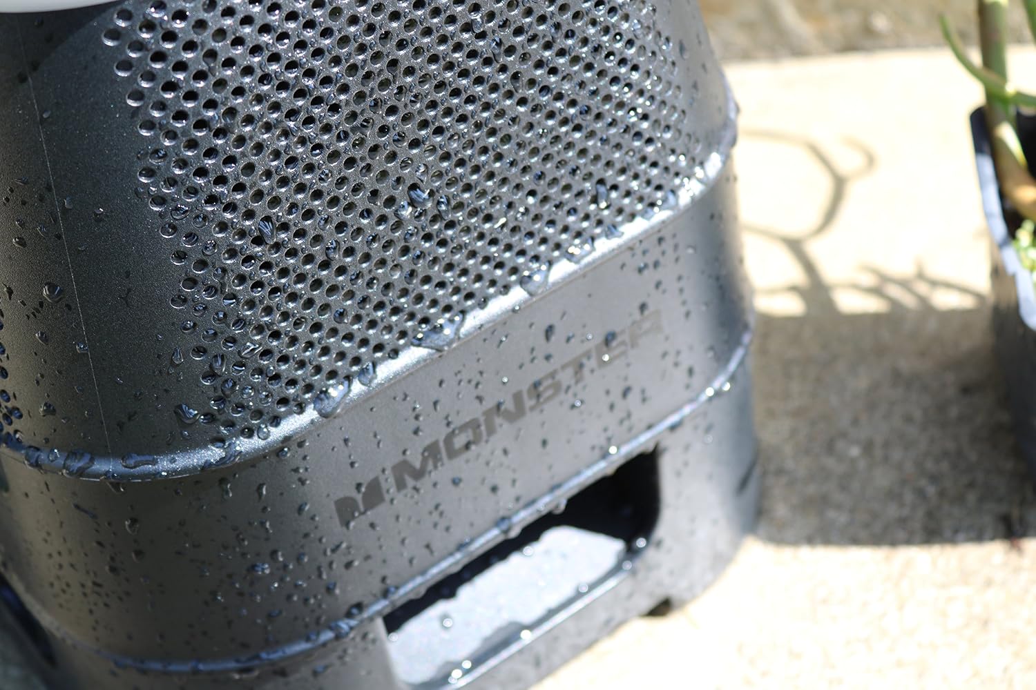 Close-up of the Monster Solara speaker with water droplets on its surface