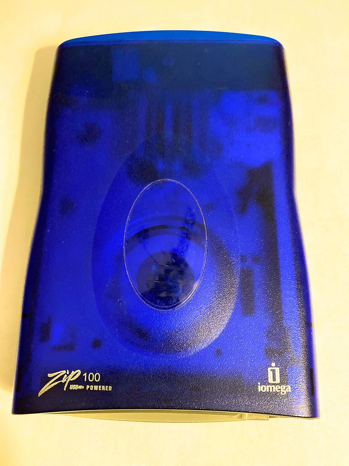 Iomega 100MB USB Powered Zip Drive, top view, blue translucent casing