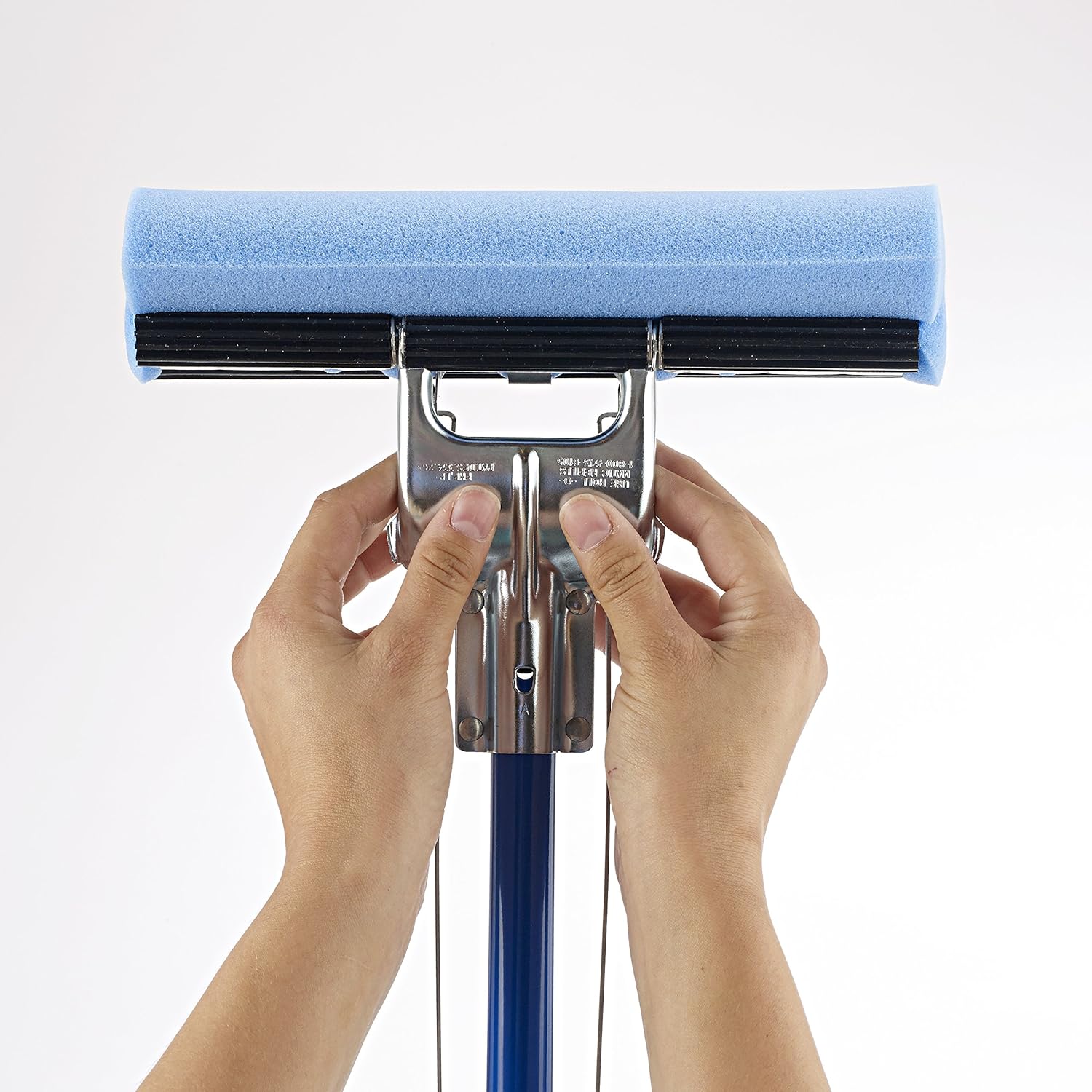 Hands holding the mop head, showing the attachment points for the sponge.