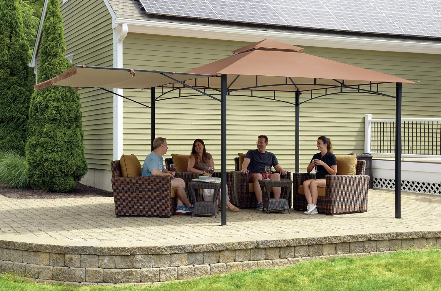 ShelterLogic Redwood Canopy with the extendable awning fully deployed, providing additional shade for a seating area.