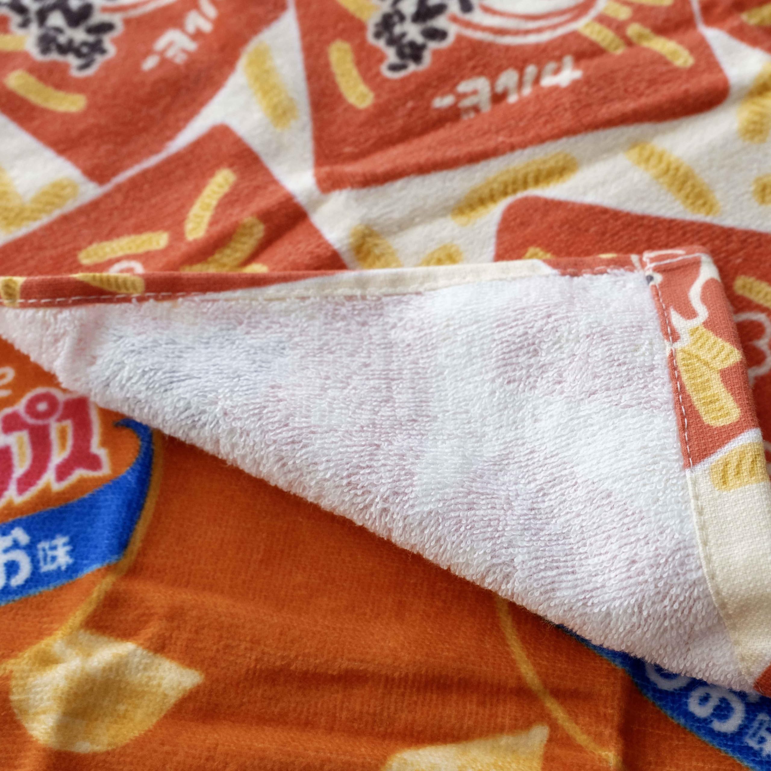 Amazon｜おもしろ フェイスタオル 皆様ご存じの スナック菓子 デザイン
