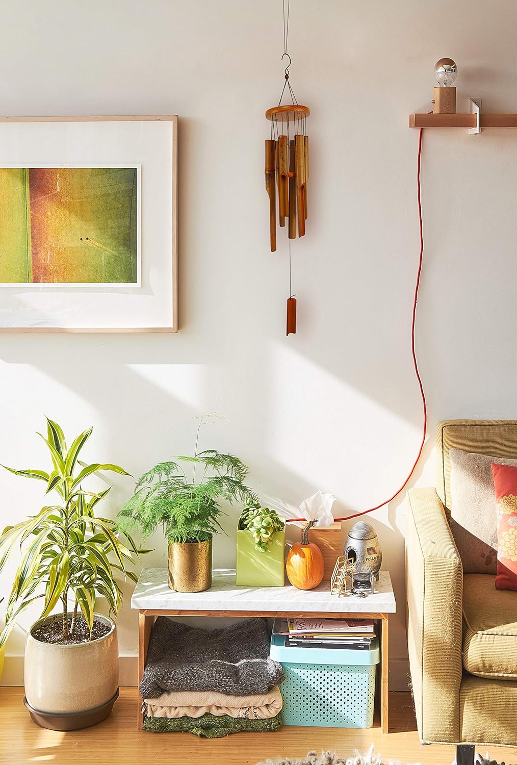 MUMTOP Bamboo Wind Chime hanging indoors above a side table with plants.