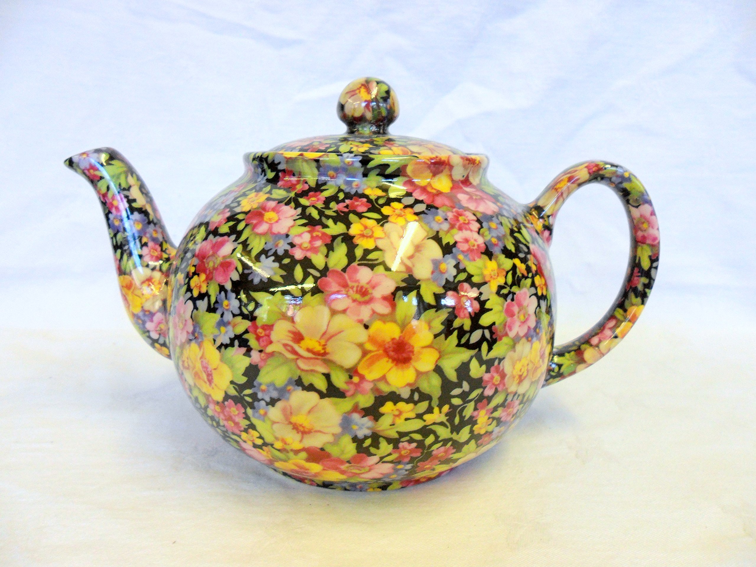 2 cup teapot in black meadow flowers design by Heron Cross Pottery.