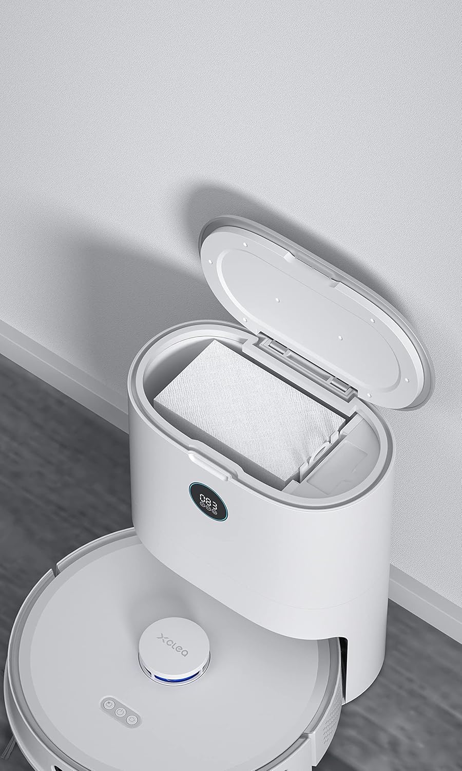 Xiaomi XCLEA H30 Plus dust collection station with its top lid open, showing a disposable dust bag