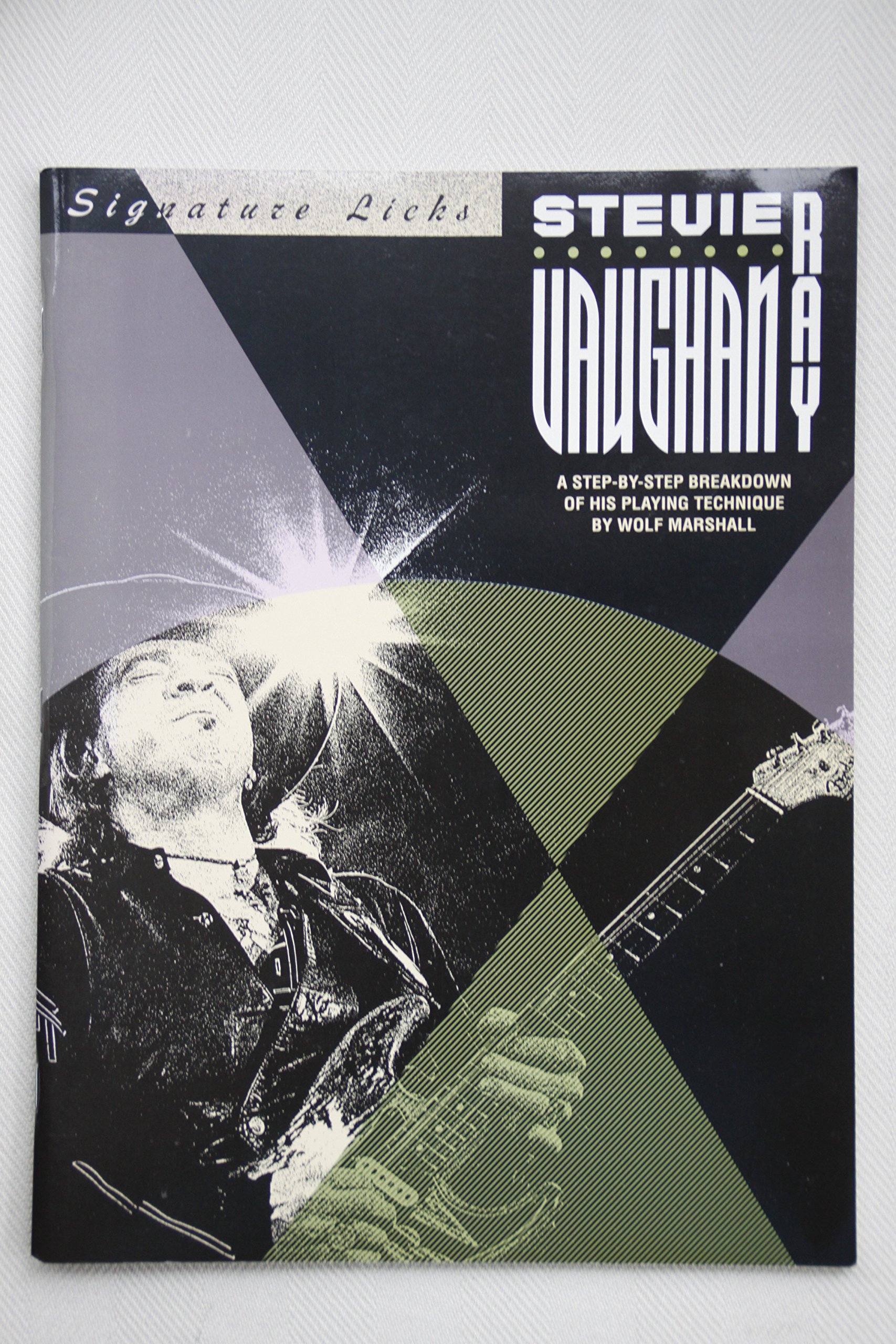 Stevie Ray Vaughan: A Step-by-Step Breakdown of his Playing Technique (Signature Licks) Paperback – October 1, 1991