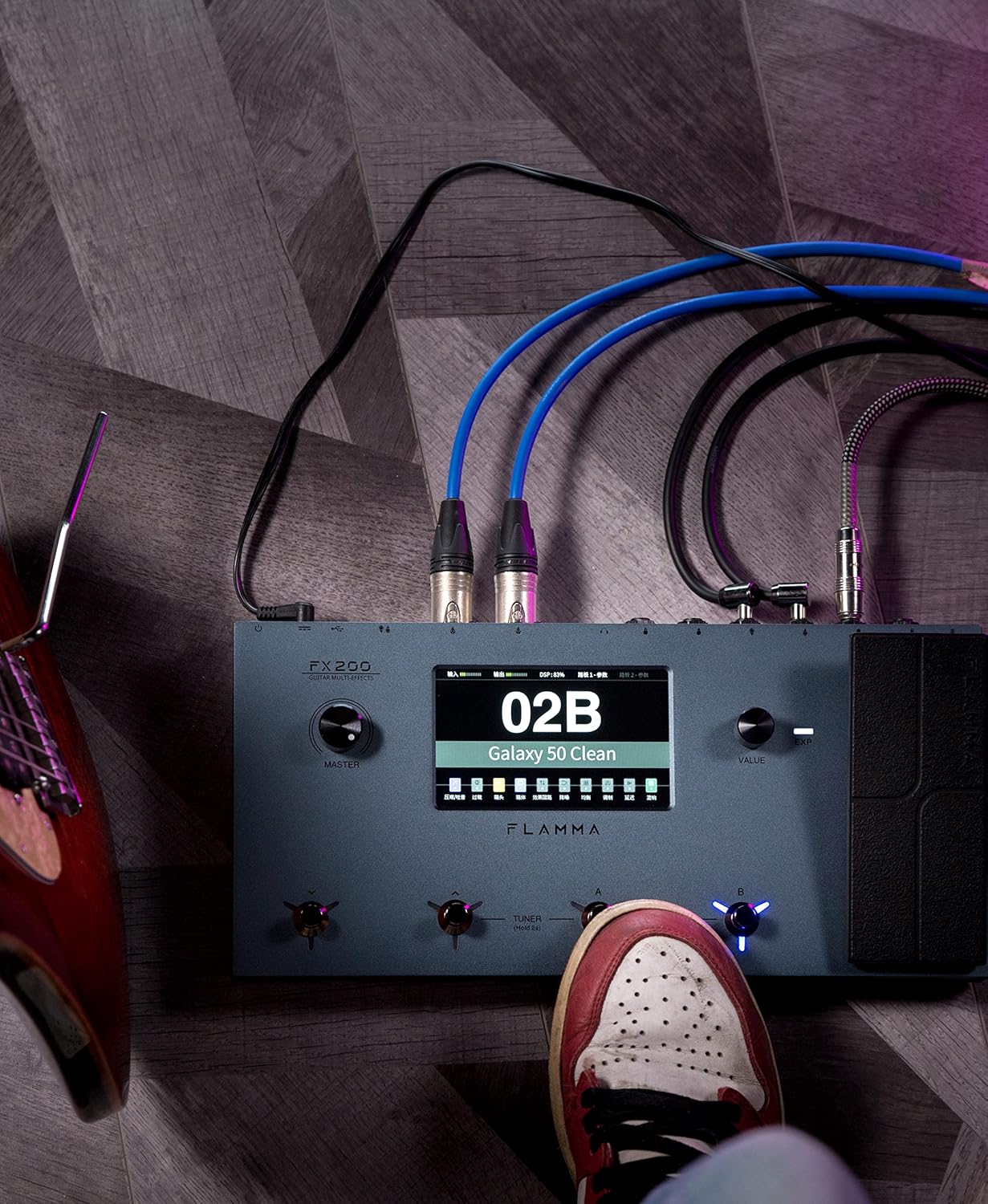 FLAMMA FX200 connected to a guitar and amplifier, with cables neatly arranged.