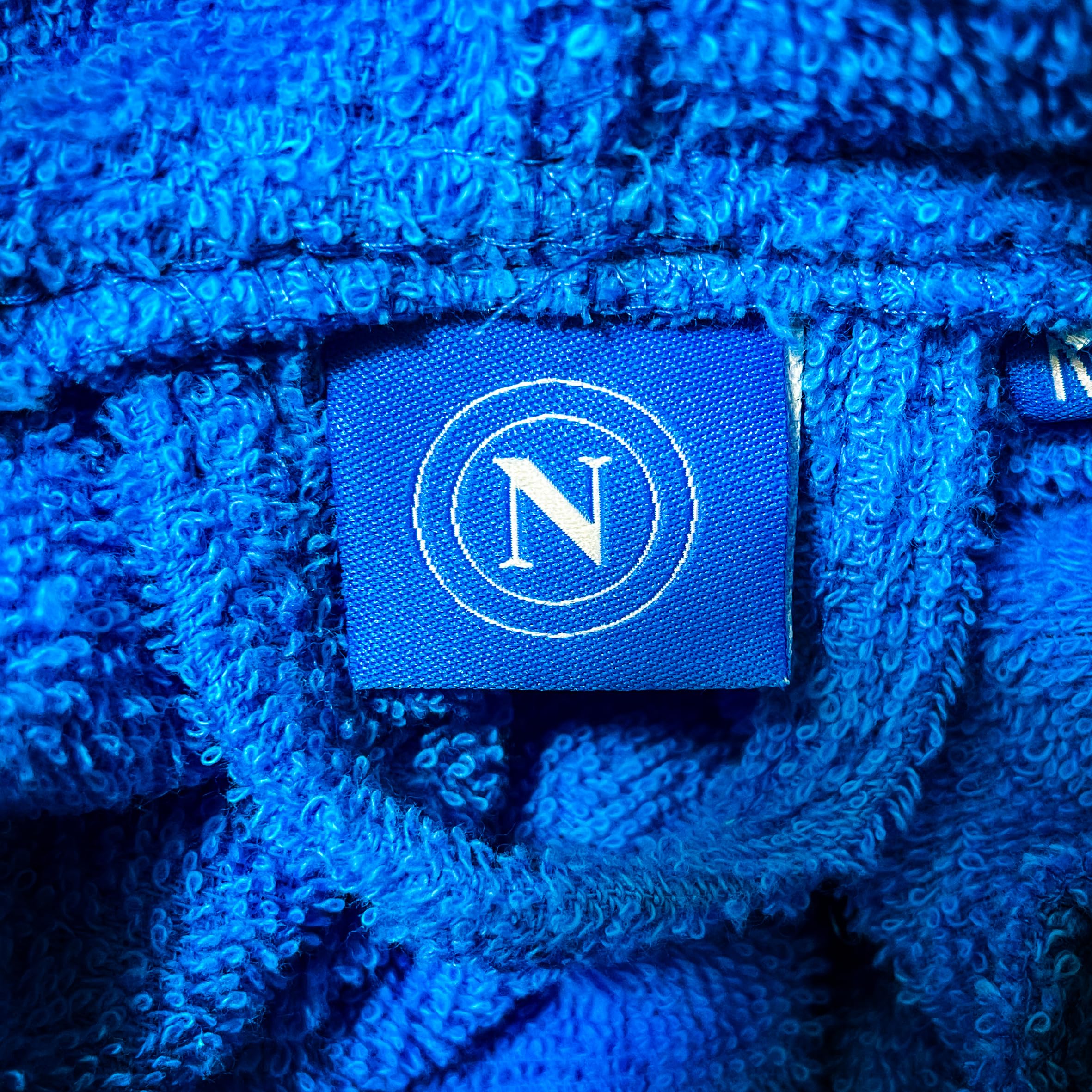 SSC Napoli, Accappatoio In Microspugna Adulto Con Cappuccio, 100% Cotone, Busta Salvaspazio, Prodotto Ufficiale, Azzurro