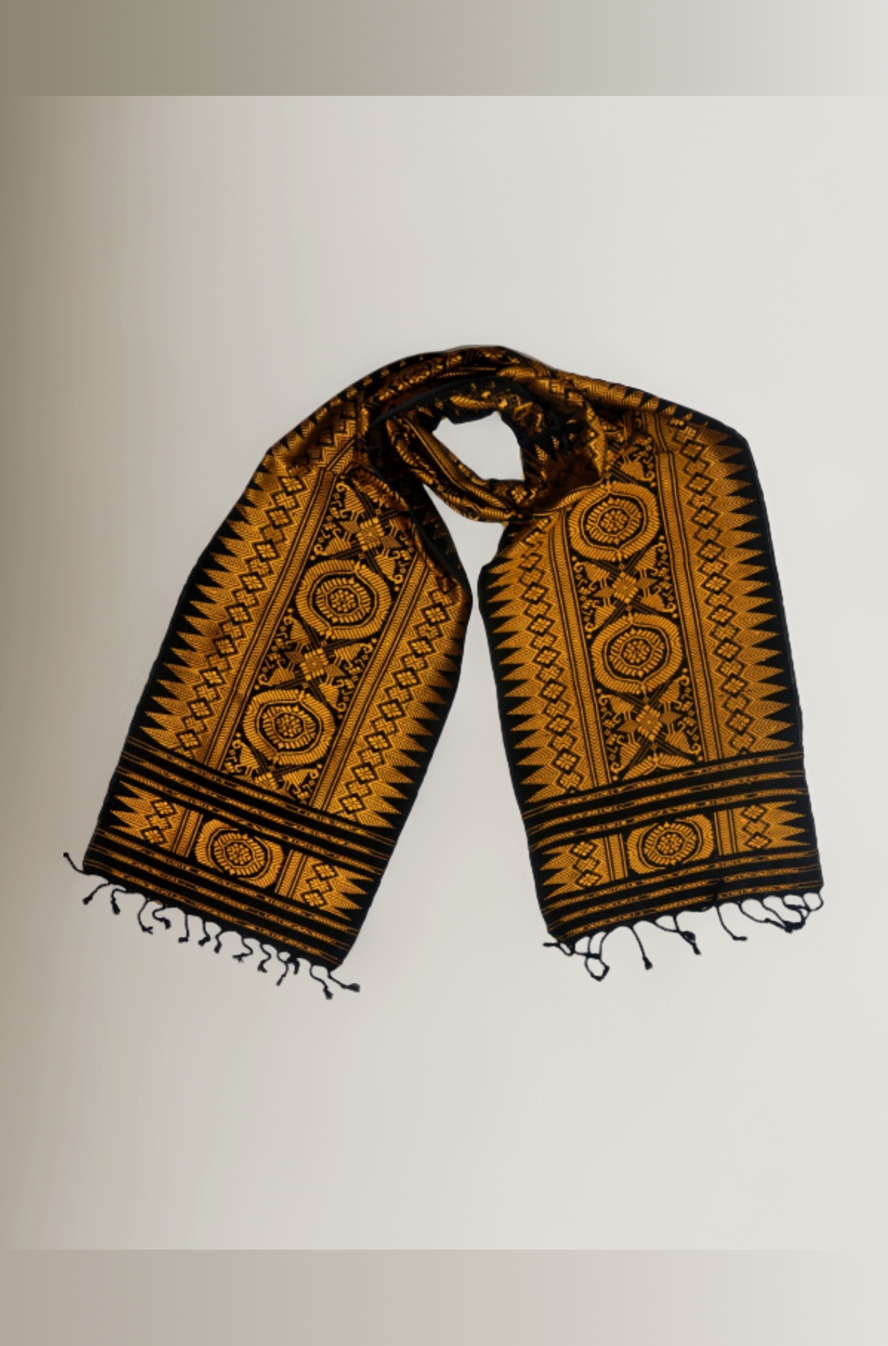 BRAND : Bodo,Boro Traditional Handwoven Ethnic Dress Aronai (MUFFLER/SCARF/STOLE-UNISEX) with different Design woven with varied colors. Color:Black & Golden .Size(190x30) cm