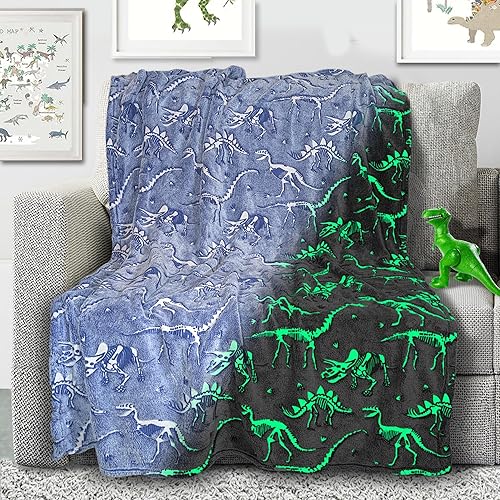 Manta de dinosaurio que brilla en la oscuridad, manta luminosa de dinosaurio para niños, manta de felpa suave azul T-Rex para niños y niñas, grande