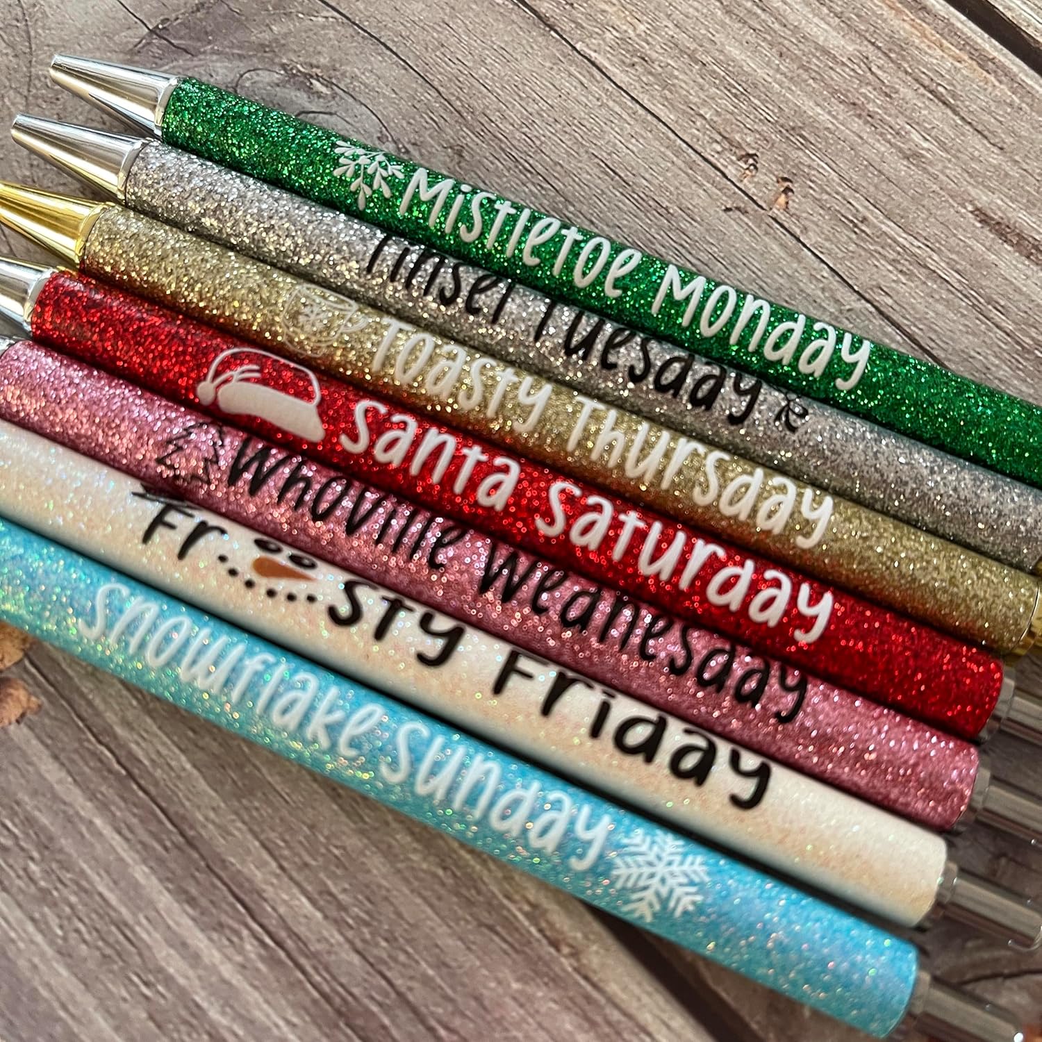Jxueych 7 Pieces Christmas Weekday Pens — Glitter Pen with Funny Sayings, Vibrant Fancy Ballpoint Pens, Cute Gifts for Colleagues Office Supplies (Christmas Pen Set)