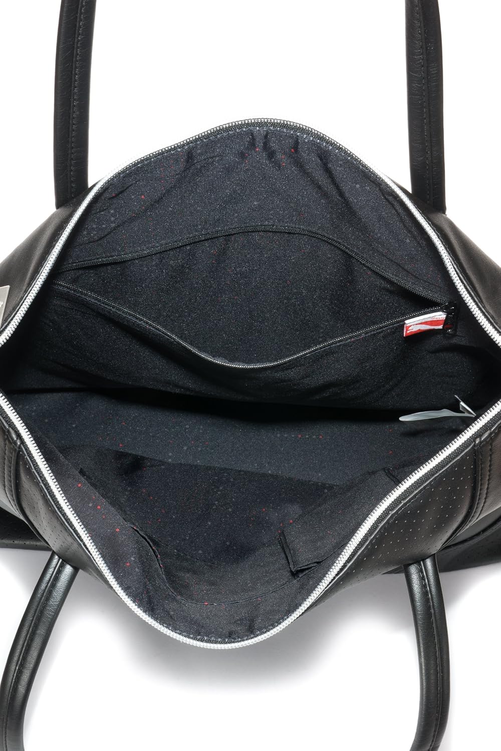 Interior view of PUMA shoulder bag showing main compartment and zipper pocket