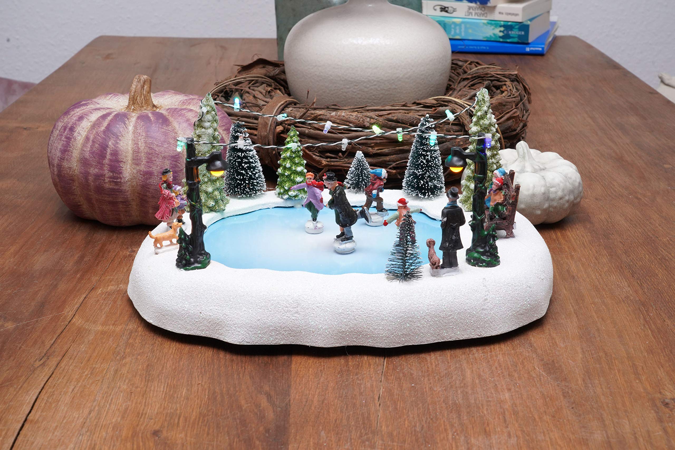Spetebo Scène de Noël LED - Patinoire avec figurines mobiles - Décoration de table - Décoration de Noël éclairée
