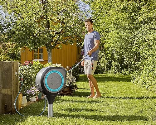 Miniatura 8 de Carrete de manguera retráctil automático de 66 pies con estaca de metal de Gardena, estándar, turquesa, 18614-20.
