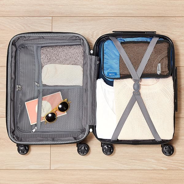 Amazon Basics, Valigia Rigida Espandibile, Bagaglio da Viaggio in ABS con 4 Ruote Girevoli Doppie, Struttura Leggera e Resistente ai Graffi, 45,1cm x 28,6cm x 68cm, Colore Nero - 3