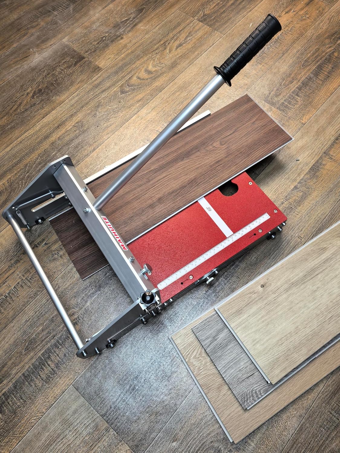 Various types of flooring materials cut into different shapes and angles using the MAIHUITE cutter.
