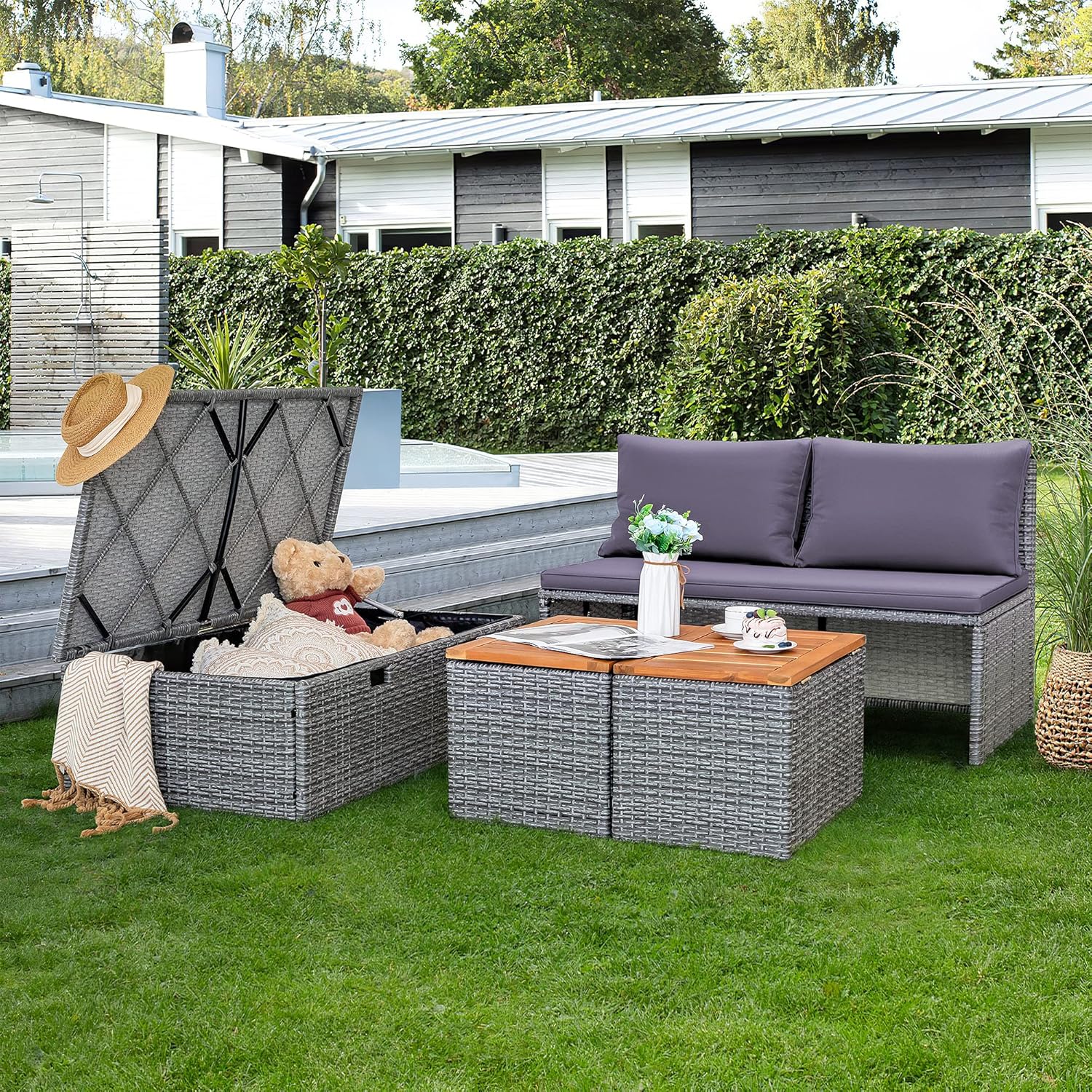 Devoko Wicker Sectional Sofa in an outdoor setting, with the large storage ottoman lid open, revealing a waterproof interior.