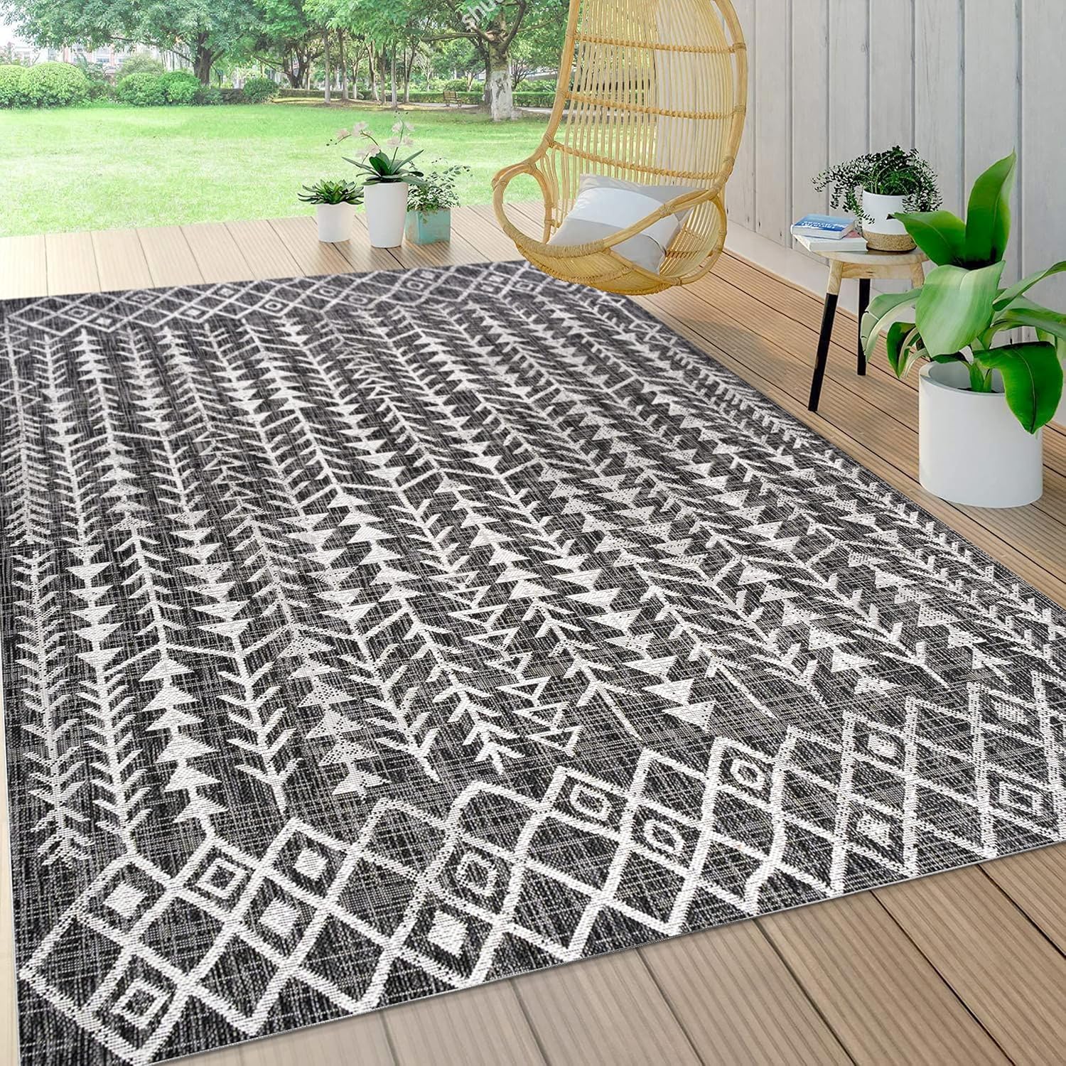 4' x 6' Black and Ivory Geometric Synthetic Area Rug