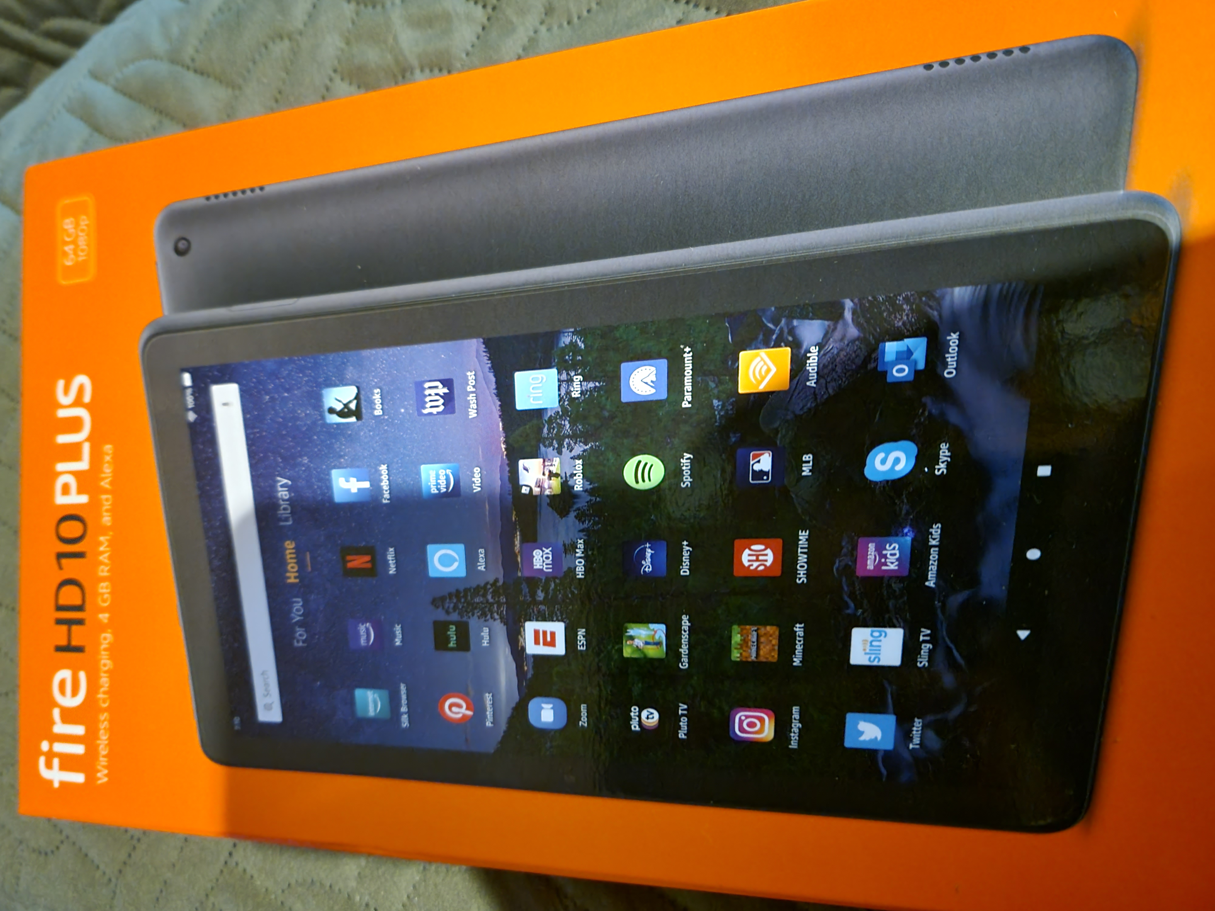 Fire HD 10 Plus tablet with an attached keyboard case showing a calendar and email