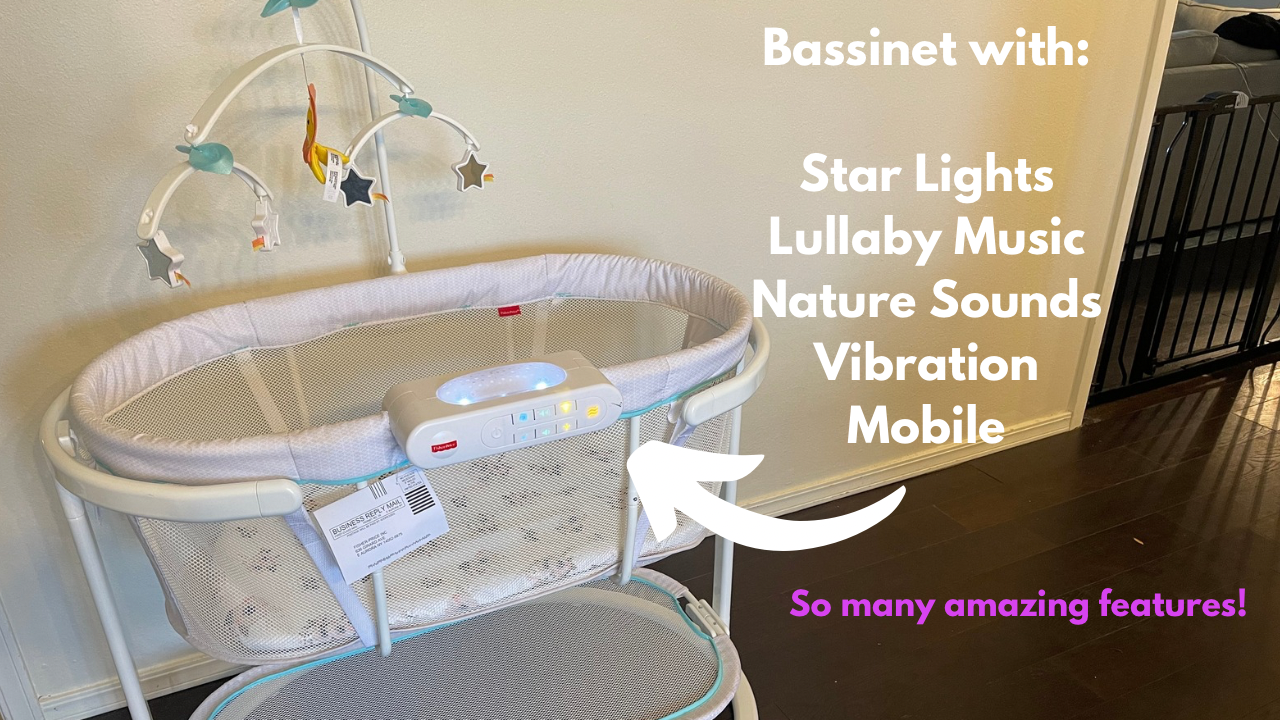 Close-up of the Fisher-Price Soothing Motions Bassinet electronic control unit with illuminated buttons for music, sounds, lights, and vibration.