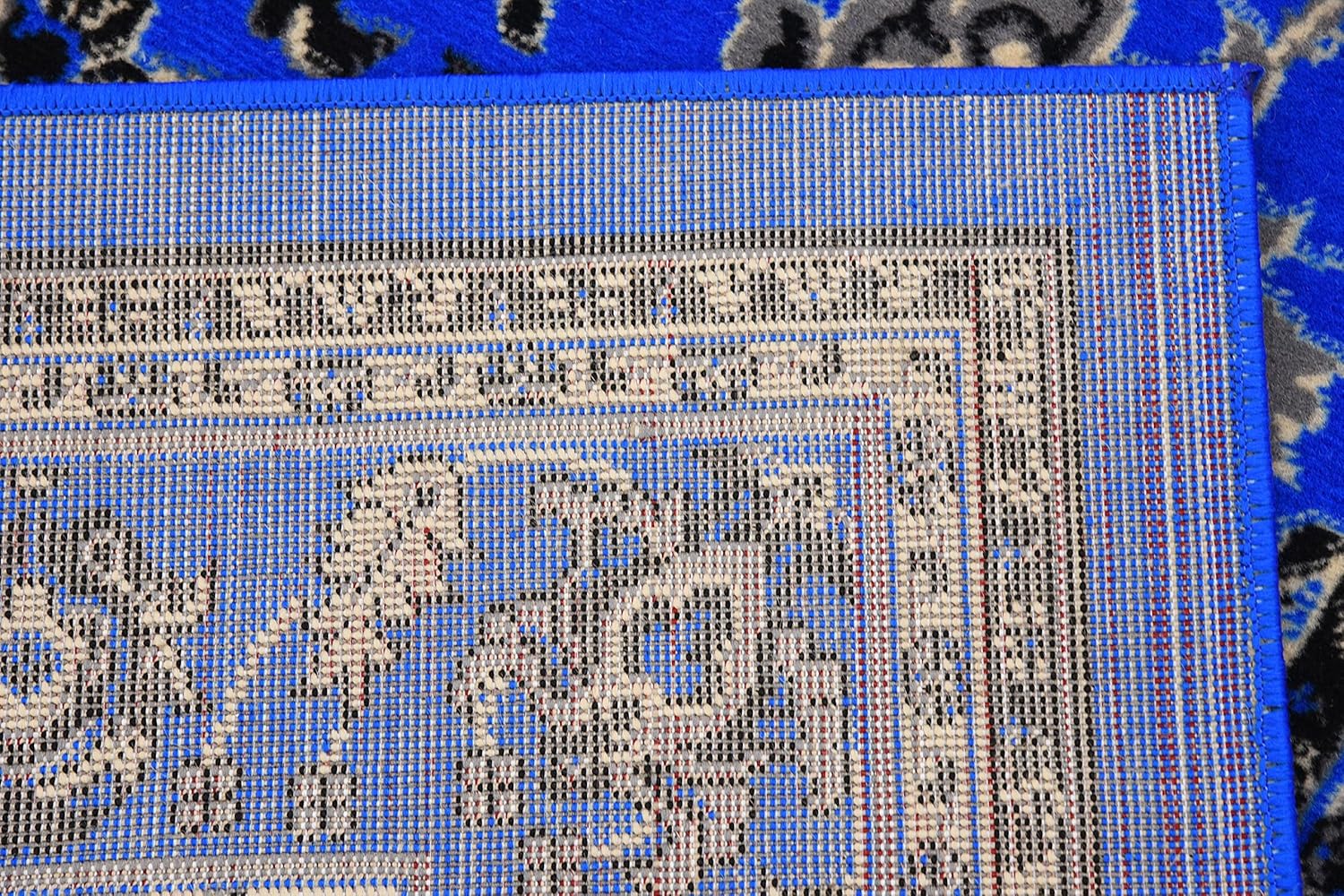 Rectangular 6' x 9' Blue and Ivory Synthetic Easy-Care Area Rug