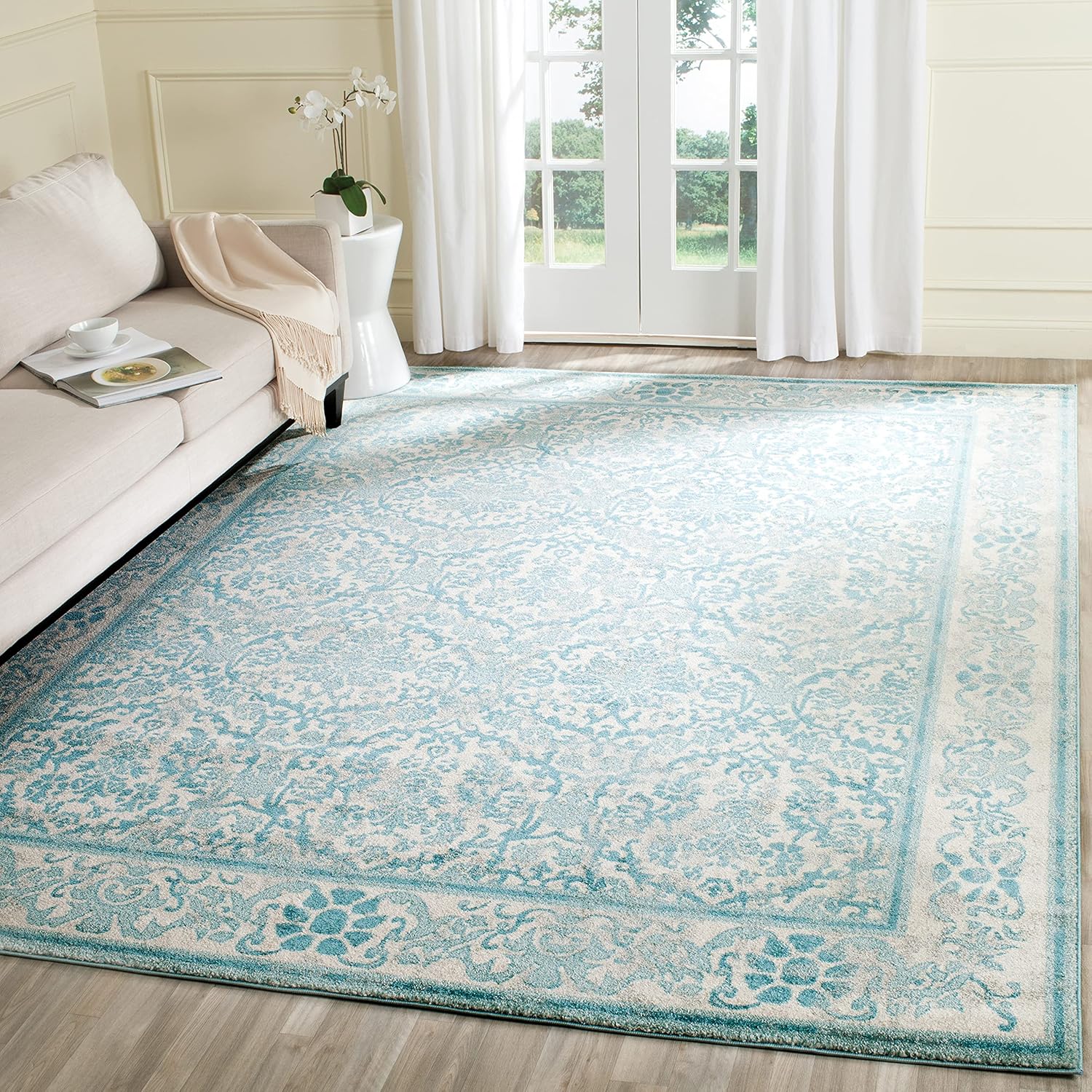 Ivory and Light Blue Floral Synthetic 8' x 10' Area Rug