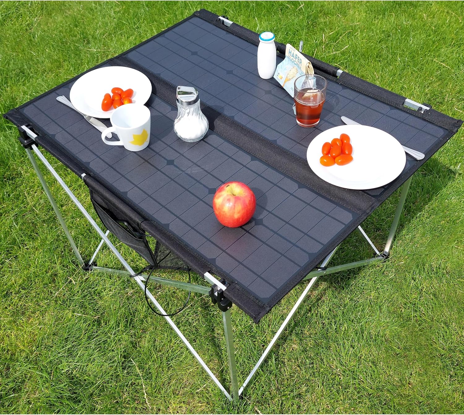 Technaxx TX-252 Foldable Solar Camping Table connected to an external power station.